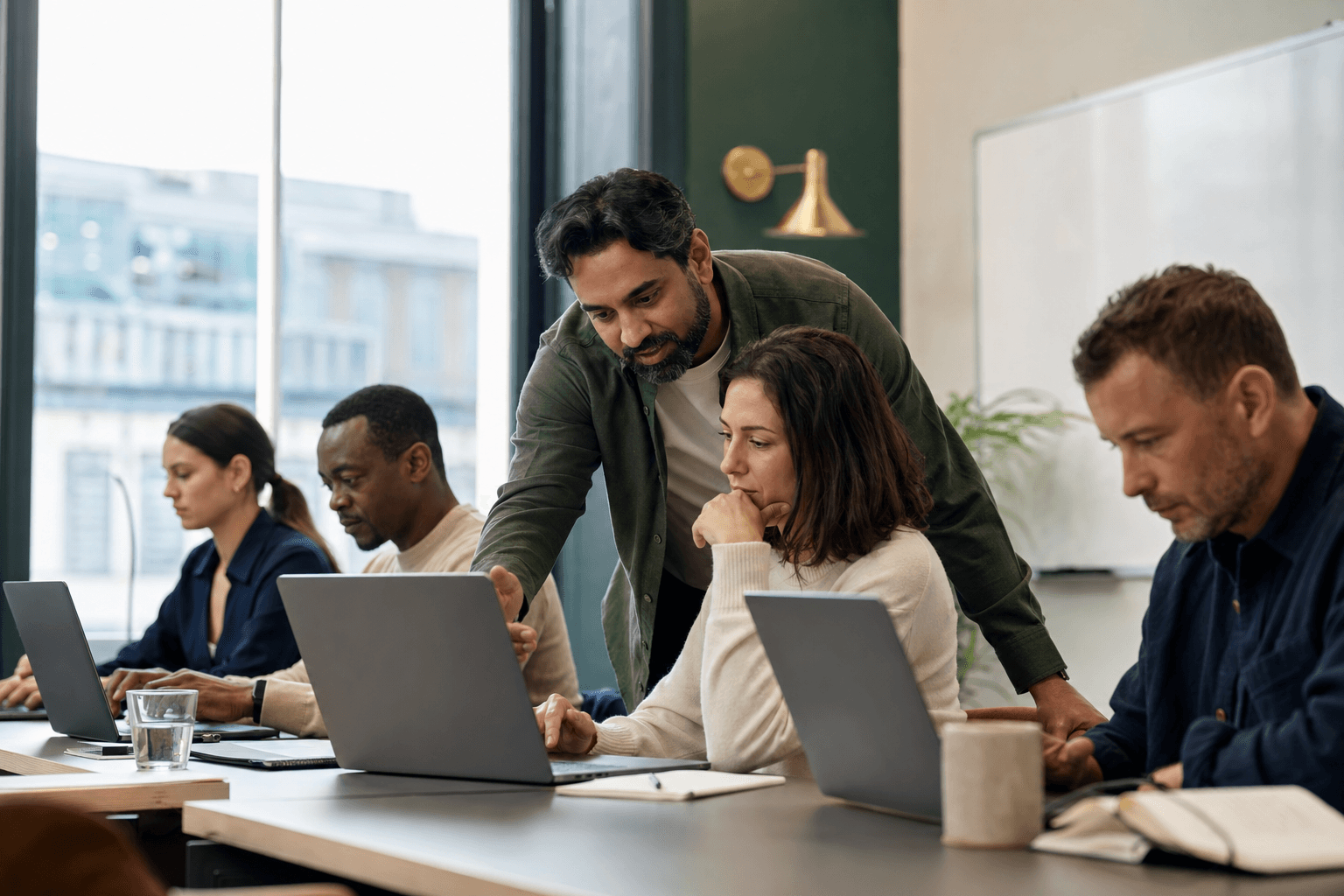Professionals working with AI tools during a weekend workshop